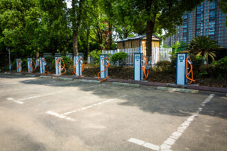 Leveraging Investments in Electric Vehicle Charging Stations to Maximize Public Benefits
